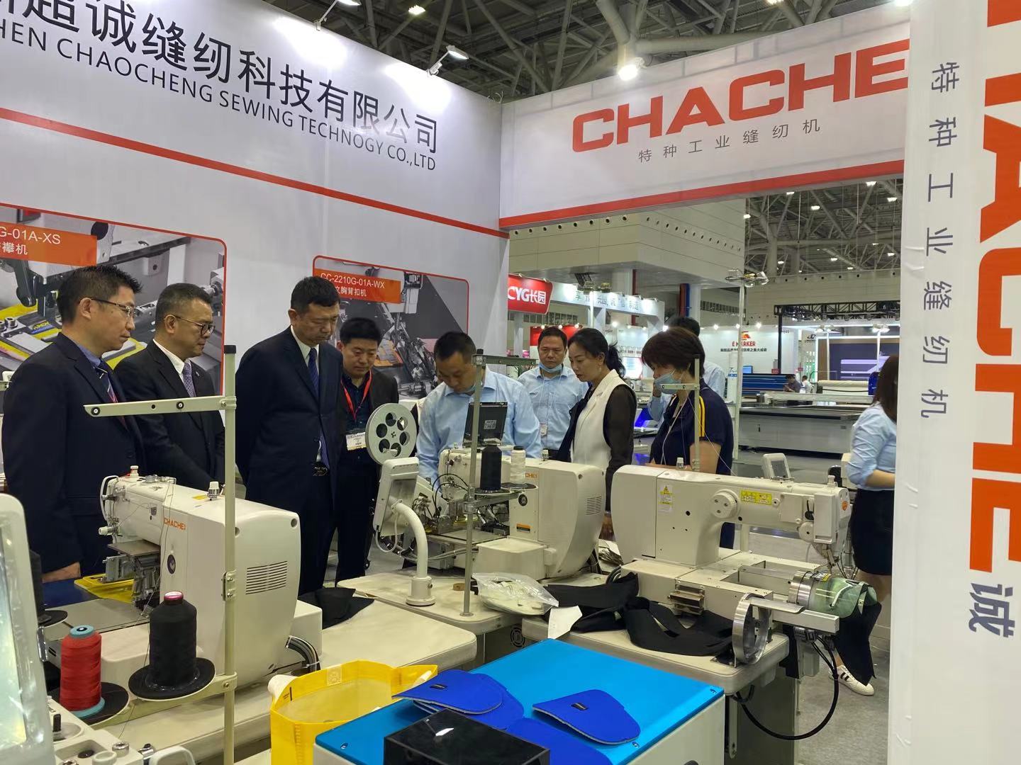 Customers are checking the template exchanging system in our computerized sewing machine.  a